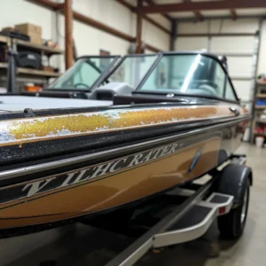 bass boat partially taped before spraying